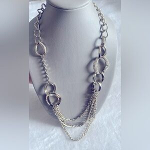 Silver long necklace with rhinestone detail.